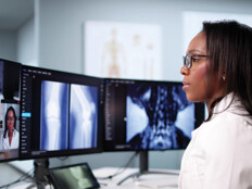 doctor on conference call with care team